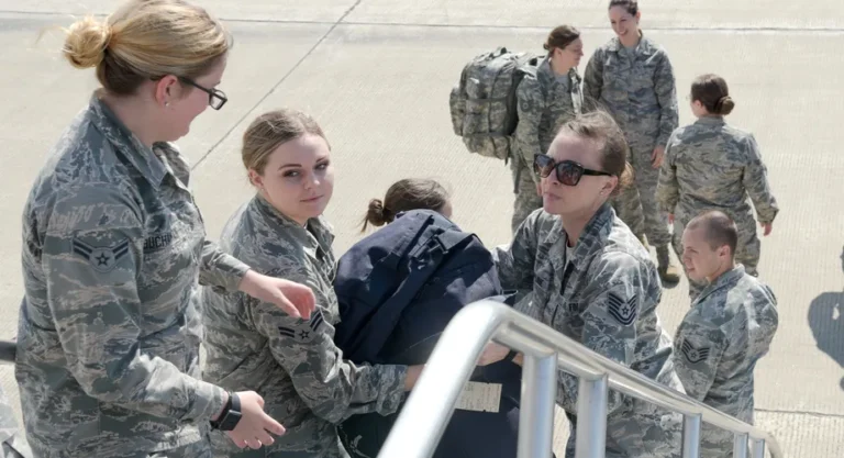 U.S. Air Force airmen loading bags onto a KC-135 Stratotanker before departing on TDY travel.