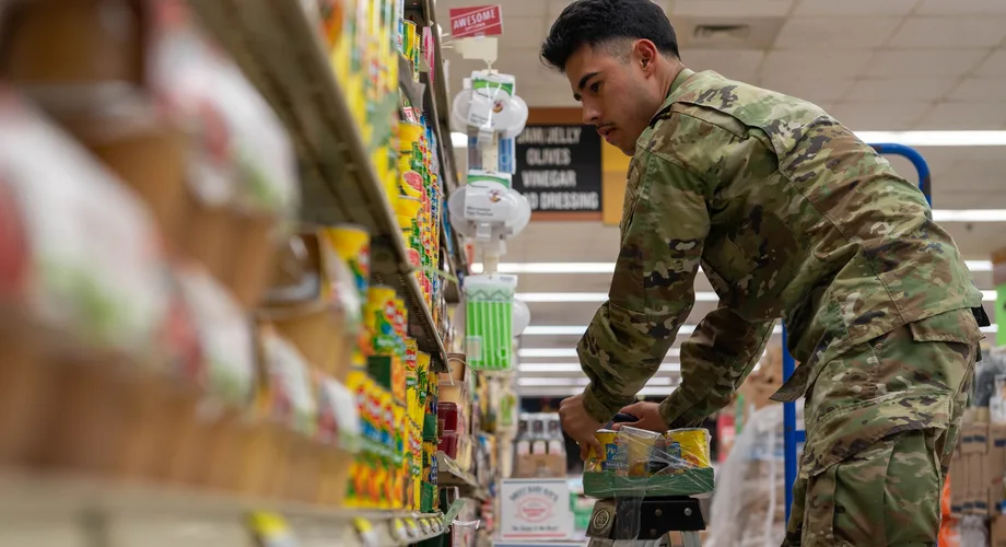 U.S. Army soldier shopping for groceries in a military commissary